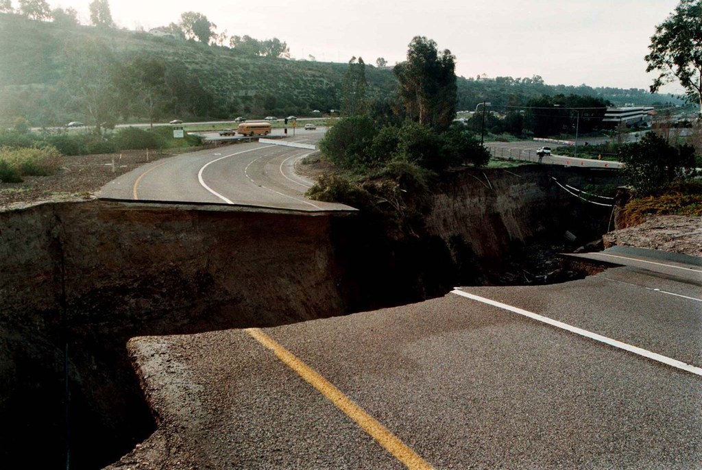 A sinkhole caused by heavy rain is seen on an on-ramp to Interstate 15 in San Diego on Feb. 24, 1998.