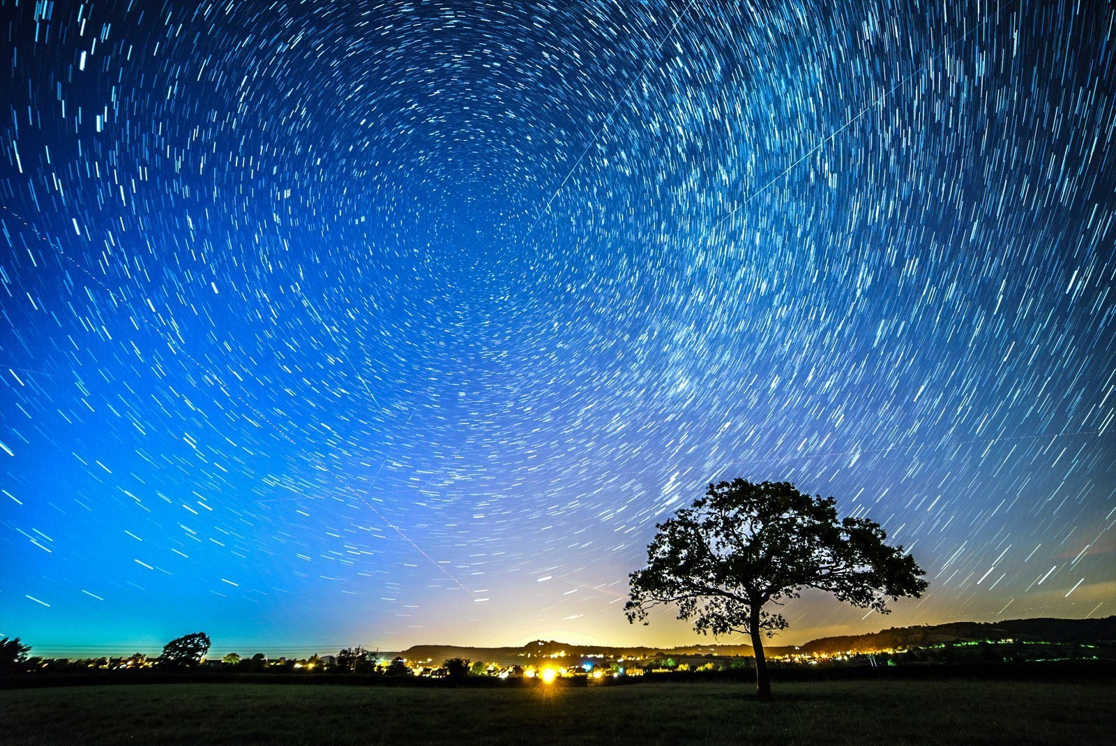 The Perseid Meteor Shower, caused by particles of dust and ice from the Swift-Tuttle comet, is visible over Wotton-under-Edge, Gloucestershire, U.K.