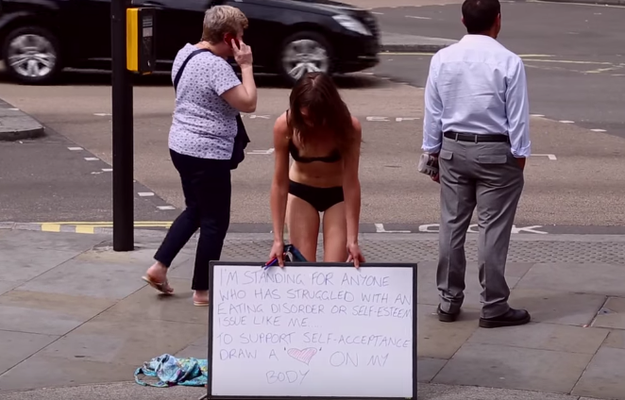 A Woman Undressed To Her Underwear In Public To Encourage Body