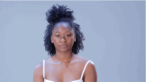 • Gather a section of hair near the crown of your head. It should be about three inches wide, and three inches deep. Define and elongate curls. Secure section up into a messy bun using a hair tie or pins.• Tease out the rest of your curls and finish the look with hairspray.