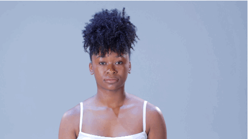 • Gather all of your hair in your hands and pull it into a tight ponytail near the front of your head. Secure with a soft hair tie.• Smooth the edges of your pulled-back hair and define the loose curls.