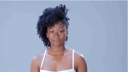 • Push your hair over to one side. Take the “smooth side” and divide it into three sections. Take each section and twist it. Secure each twist down to your scalp using bobby pins.• Take a cream and use it to smooth out the twists, then add a few dabs to the loose curls for extra elongation.• Define the shape you’ve created by adding a few long decorative pins.