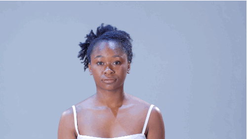 • Take the front section of your hair, then gently twist the hair while pushing it forward to create a bit of volume. Secure with bobby pins. • Gather the remaining hair into a hair tie. Finish with hairspray.