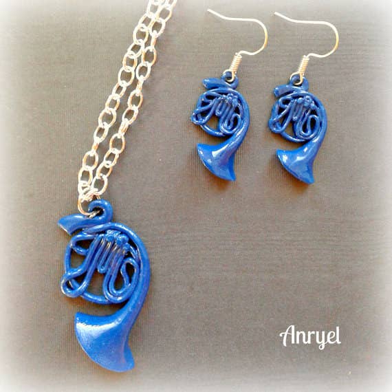 Robin might have the blue french horn from "Carmichaels," but you can wear a cute and stylish mini versions of it. Get it here.