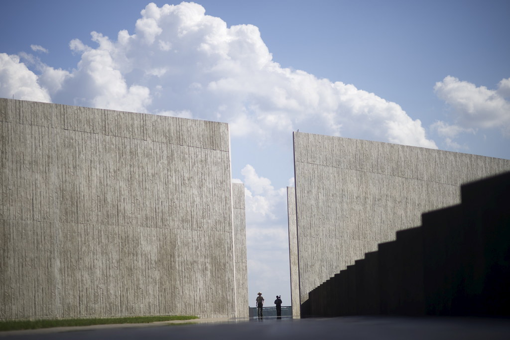 United States Park Rangers walk through the memorial.