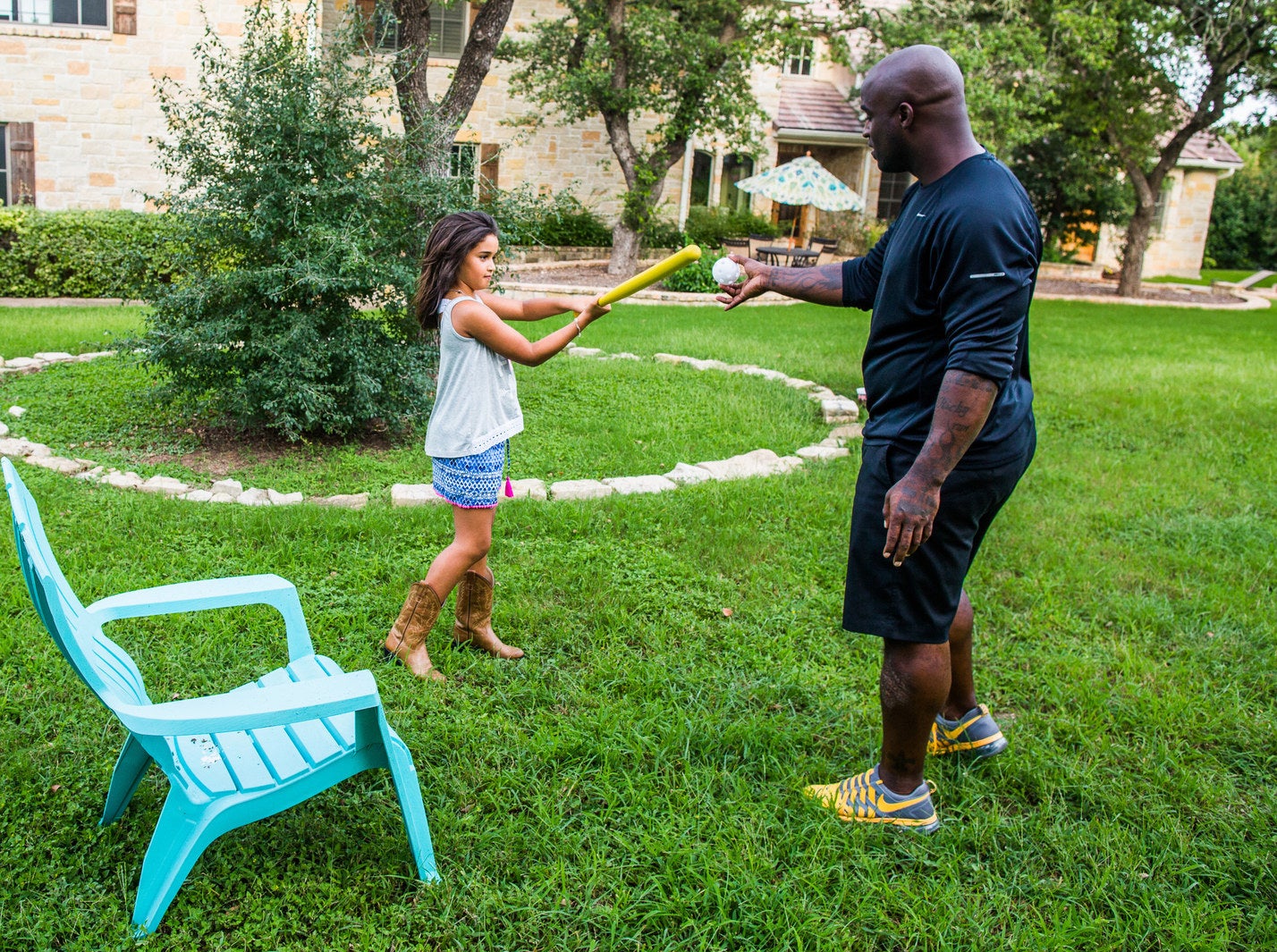 Williams and his daughter Asha at home in Texas.