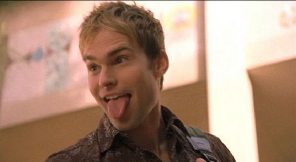 a screenshot from american  pie with his tongue out