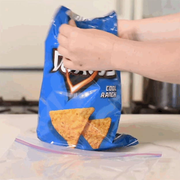 Put them in a plastic bag. Zip it up. Bang it on the table until all the Doritos are just Doritos crumbs.