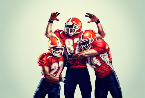 Bill, Ken, and Mark are — not necessarily in this order — a quarterback, a receiver, and a kicker. The kicker, who is the shortest of the three, is a bachelor. Bill, who is Ken's father-in-law, is taller than the receiver. Who plays in which position?