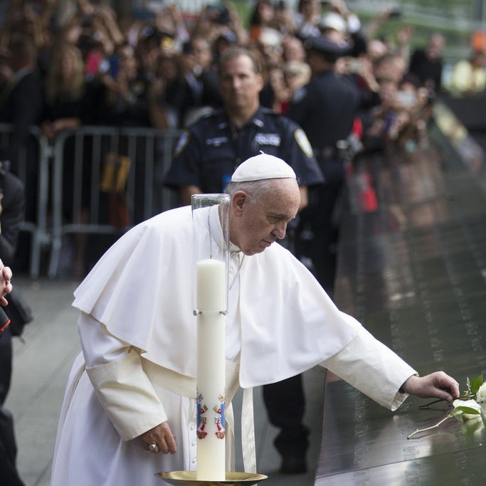 Pope Francis places a white rose at the South Pool of the 9/11 Memoria