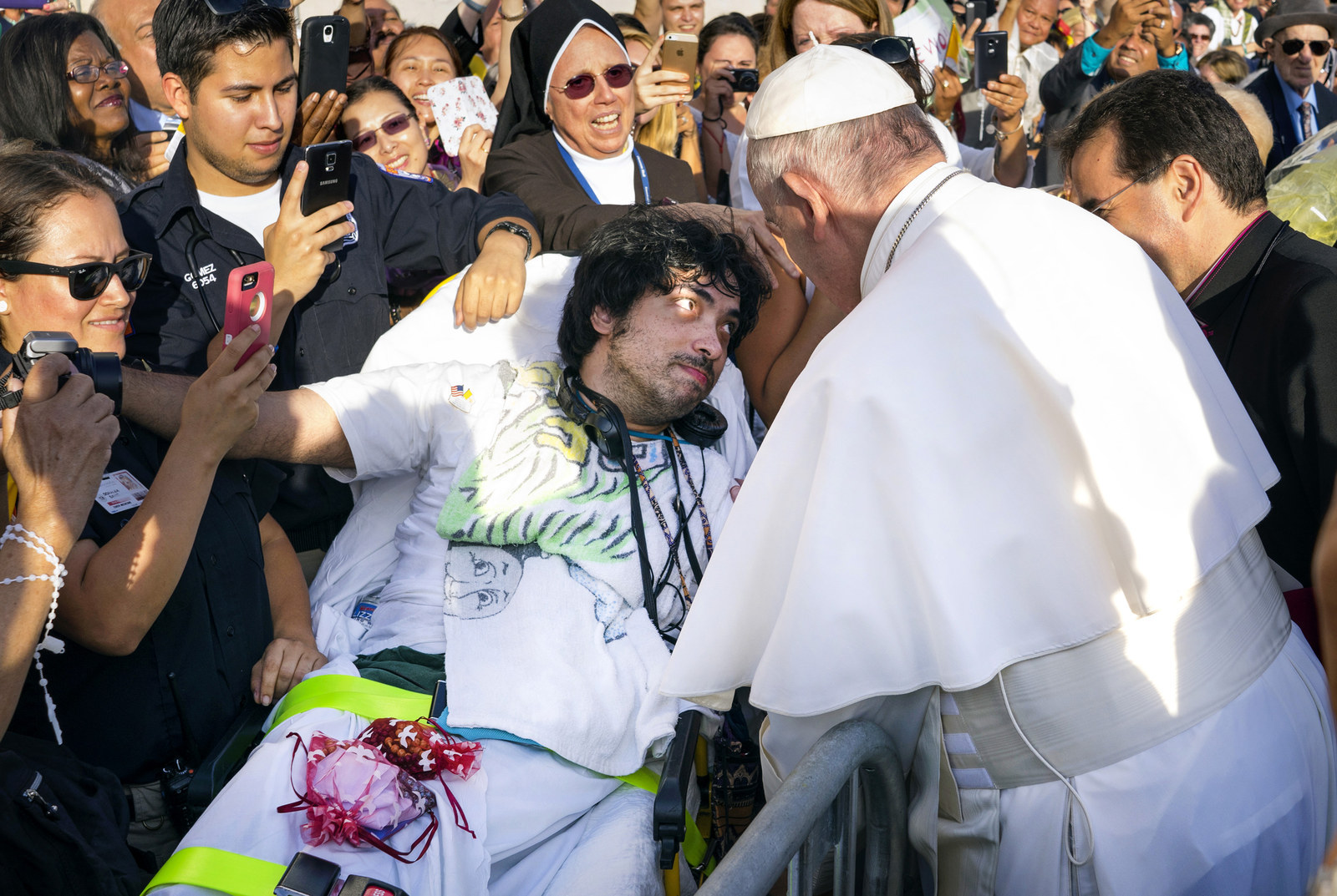 Pope Francis meets well-wishers including Gerard Gubatan, of Brooklyn, New York, after arriving at John F. Kennedy International Airport on Thursday.
