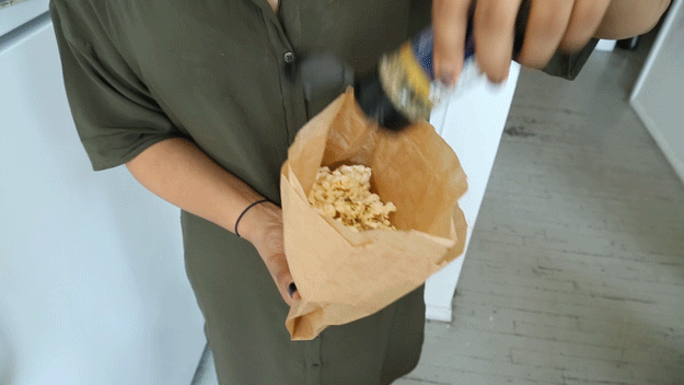 You will need: 3 Tbsp. popcorn kernels 1 lunch-sized brown paper bagMelted butter or margarineGrated parmesan cheeseGarlic powderItalian seasoning blendSaltSteps: Place kernels in brown paper bag and roll to close. Put bag in microwave and heat on high for 2 to 3 minutes. Top popcorn with melted butter or margarine, cheese, garlic powder, Italian seasoning, and salt.
