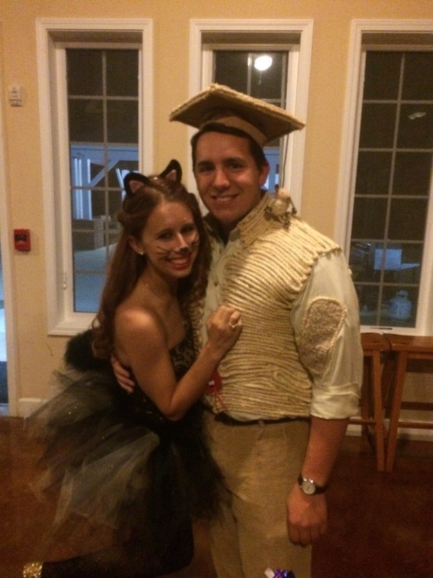 A girl wearing a cat outfit and a man wearing rope