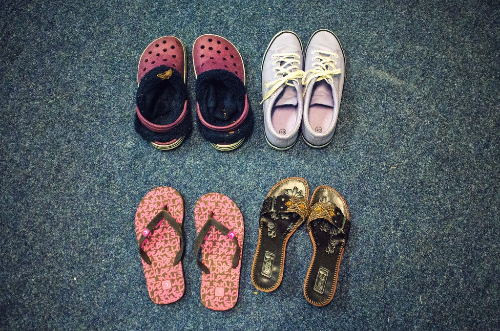 Some second-hand shoes the family has received as donations.