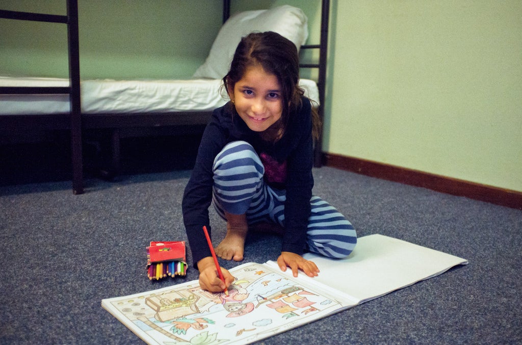 Nour with her colouring book.