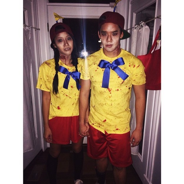 Man and woman in blood-soaked yellow shirts.