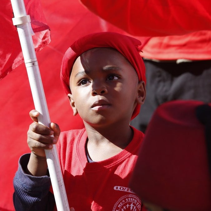 Young member of the Nation of Islam waves a flag in 2015.