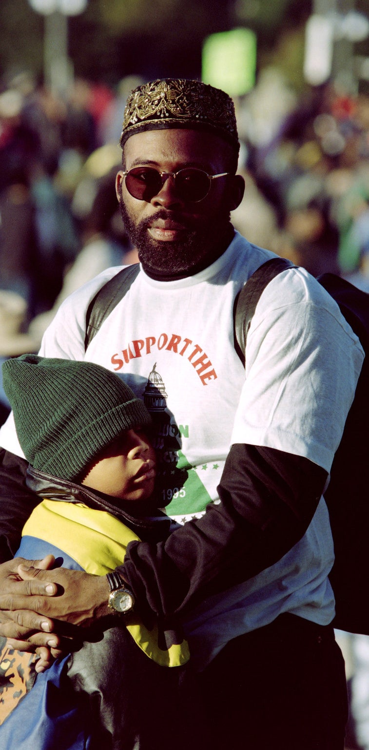 A father embraces his son in 1995.