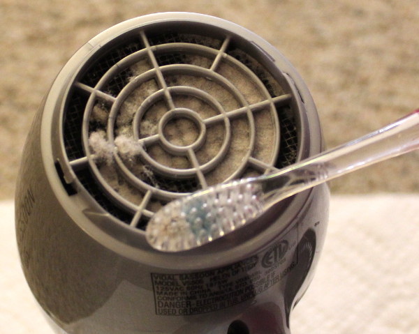 Bonus! Use an old toothbrush to clean out your clogged hairdryer.