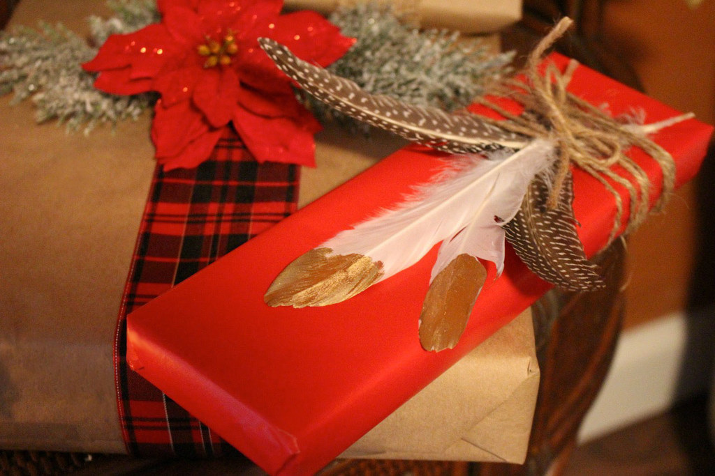 Give your rustic wrapping a little glam by gilding feathers and pinecones.