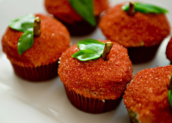 Prepare a tray of cupcakes that look like apples.