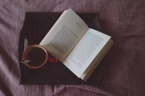 Instead of vegging out and binge-watching a television show online, cozy up in bed and get lost in a good story.