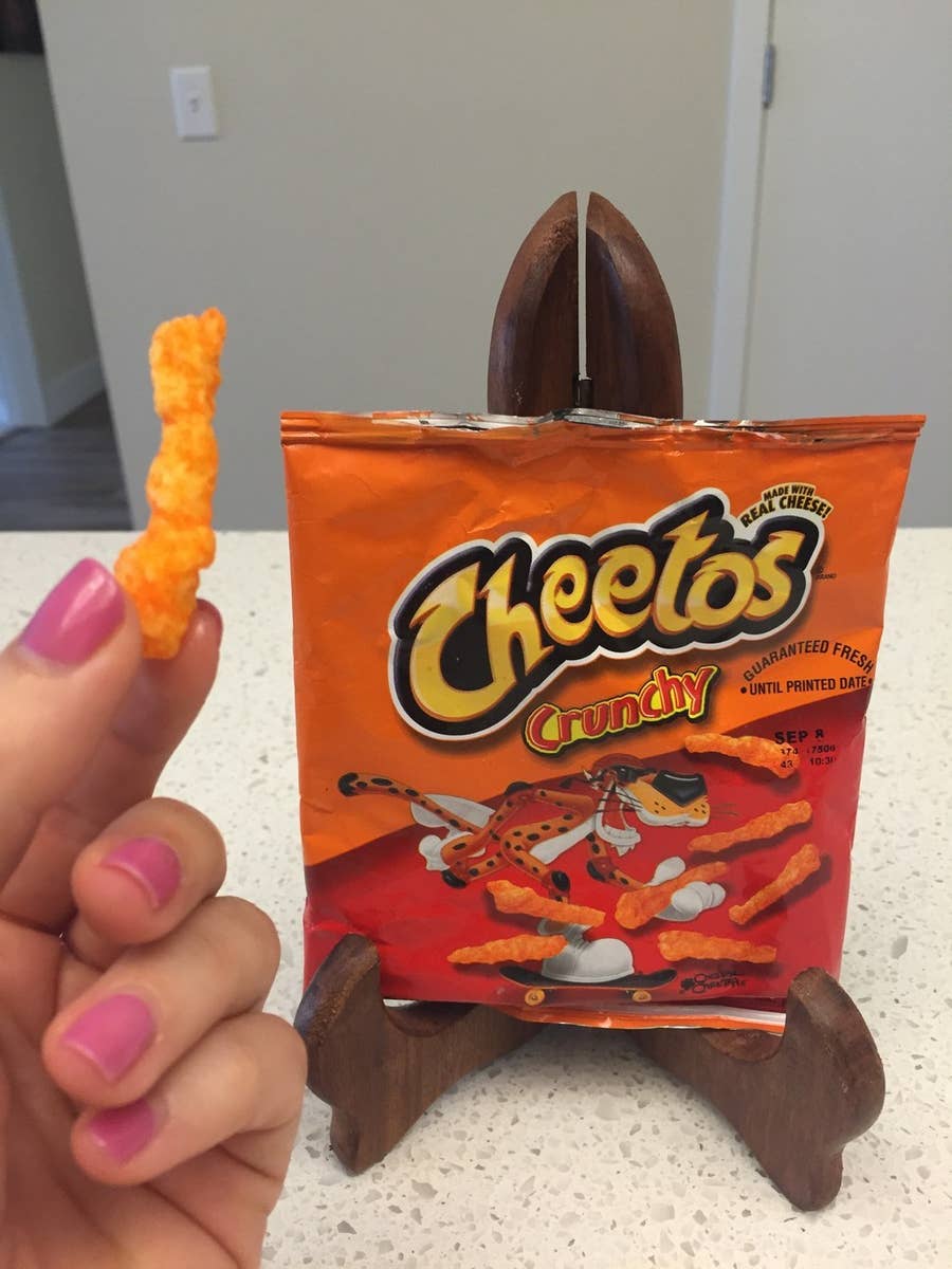 Creation of Man and of God Into Cheetos Bag With Cheese Dust