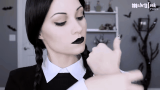 All you need is black eyeliner, black lipstick, and a dark sense of humor. Watch the whole tutorial here.