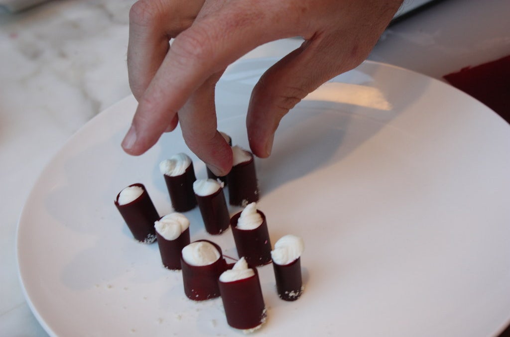 Beet strips stuffed with goat cheese.