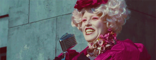 The escort for District 12, always happy not matter what. Effie is know for her famous quote: "That is mahogany!"