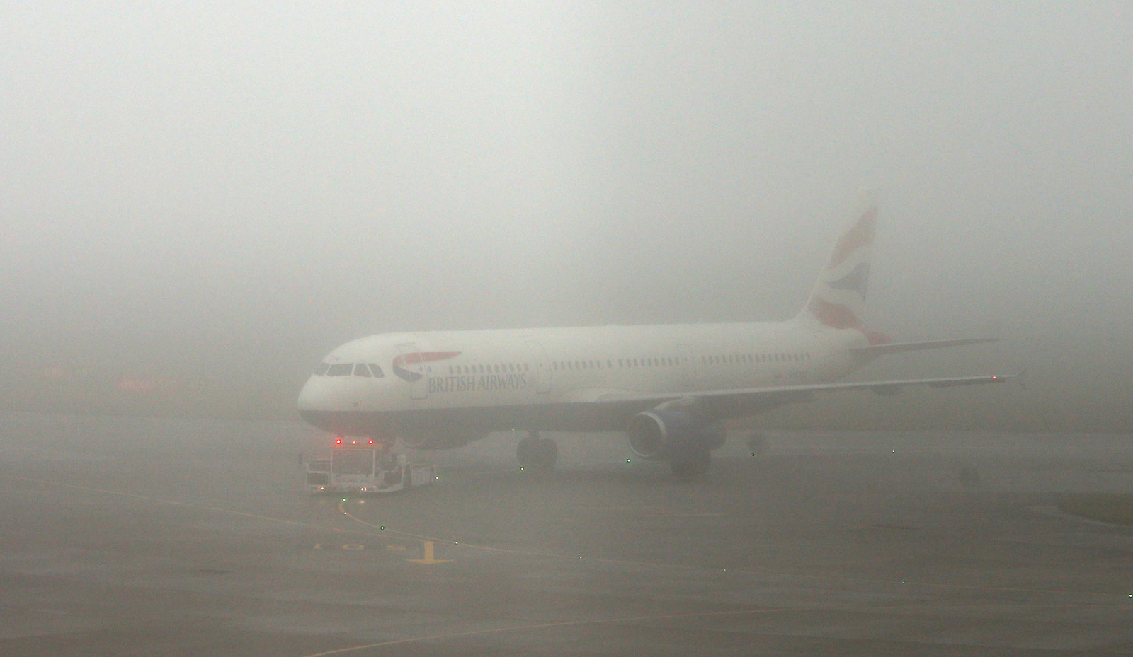 A British Airways plane at Terminal 5 of Heathrow Airport as thick fog was disrupting flights at UK airports for a second day, 2 November.