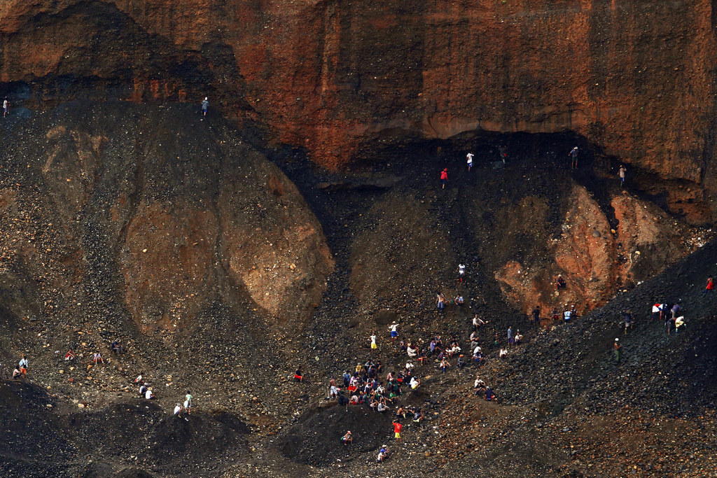 This file photo shows people searching for jade through rubble dumped by mining companies at a jade mine in Hpakant township, Kachin State, in 2013.