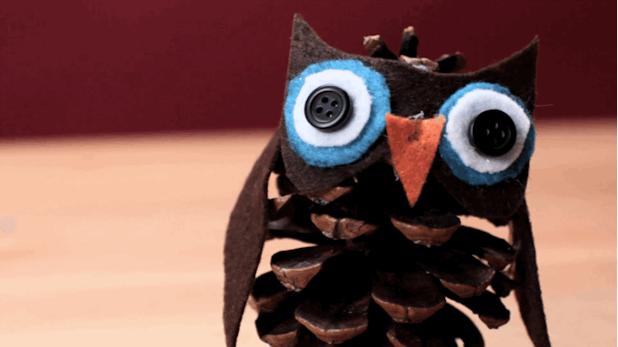 What you need: A pinecone, buttons, four colors of felt, hot glue, and scissors.What to do: Cut the felt into wings, ears, eyes, and a beak. Glue all the pieces onto the pinecone and cry from cuteness.