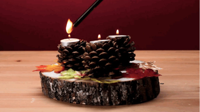 What you need: Pinecones, a hot glue gun, tea candles, and pliers.What to do: Make a flat base by cutting the top leaves. Then, remove the bottom leaves and hot glue the candle onto the surface.