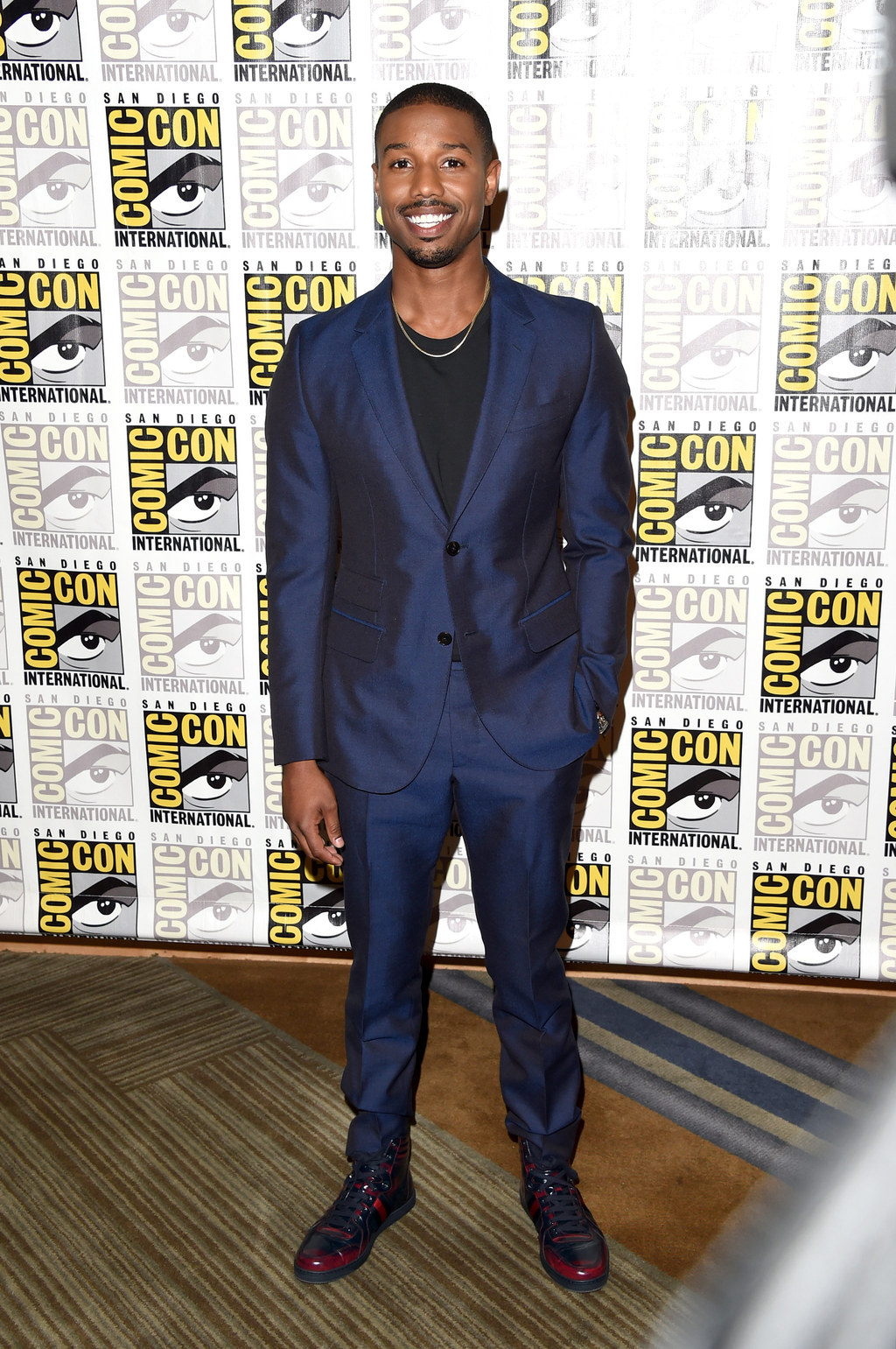 Michael B. Jordan rocks a sharp brown suit while hitting the red carpet for  Creed III