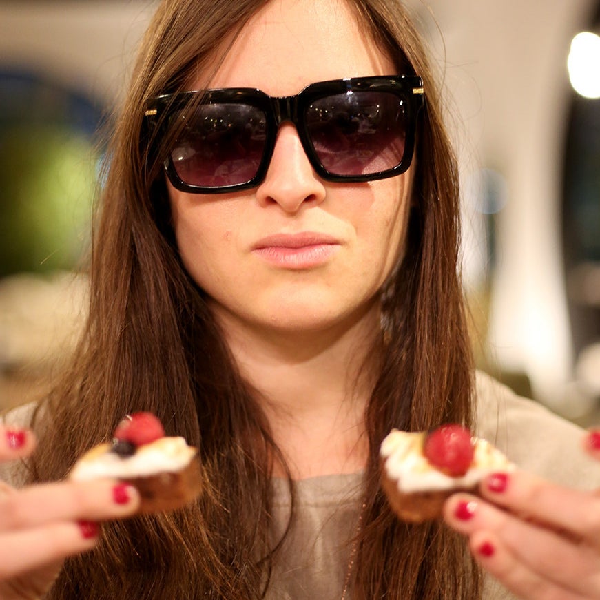 Jen double-fisting desserts.