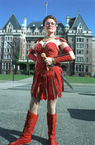 Angelo (U.S.): That's Margaret Thatcher and she drove the communists from Canada. Mat (Australia): This is Canada's foremost Xena impersonator. She goes by the name Lucy Flawless.Alicia (U.K.): Is she a Viking impersonator for children's parties who found fame for being just generally hilarious and keeping the adults entertained and now she has her own TV show and is generally beloved by all?Ema (U.S.): Cheryl Odinstien. She's the Canadian female Hugh Hefner.Sheridan (U.S.): She is a comedian who likes to dress up as Xena the Warrior Princess and accost people on the street like Billy on the Street?