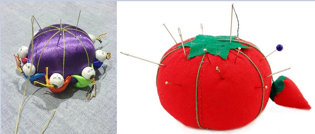 Pincushions in the shape of tomatoes and other objects