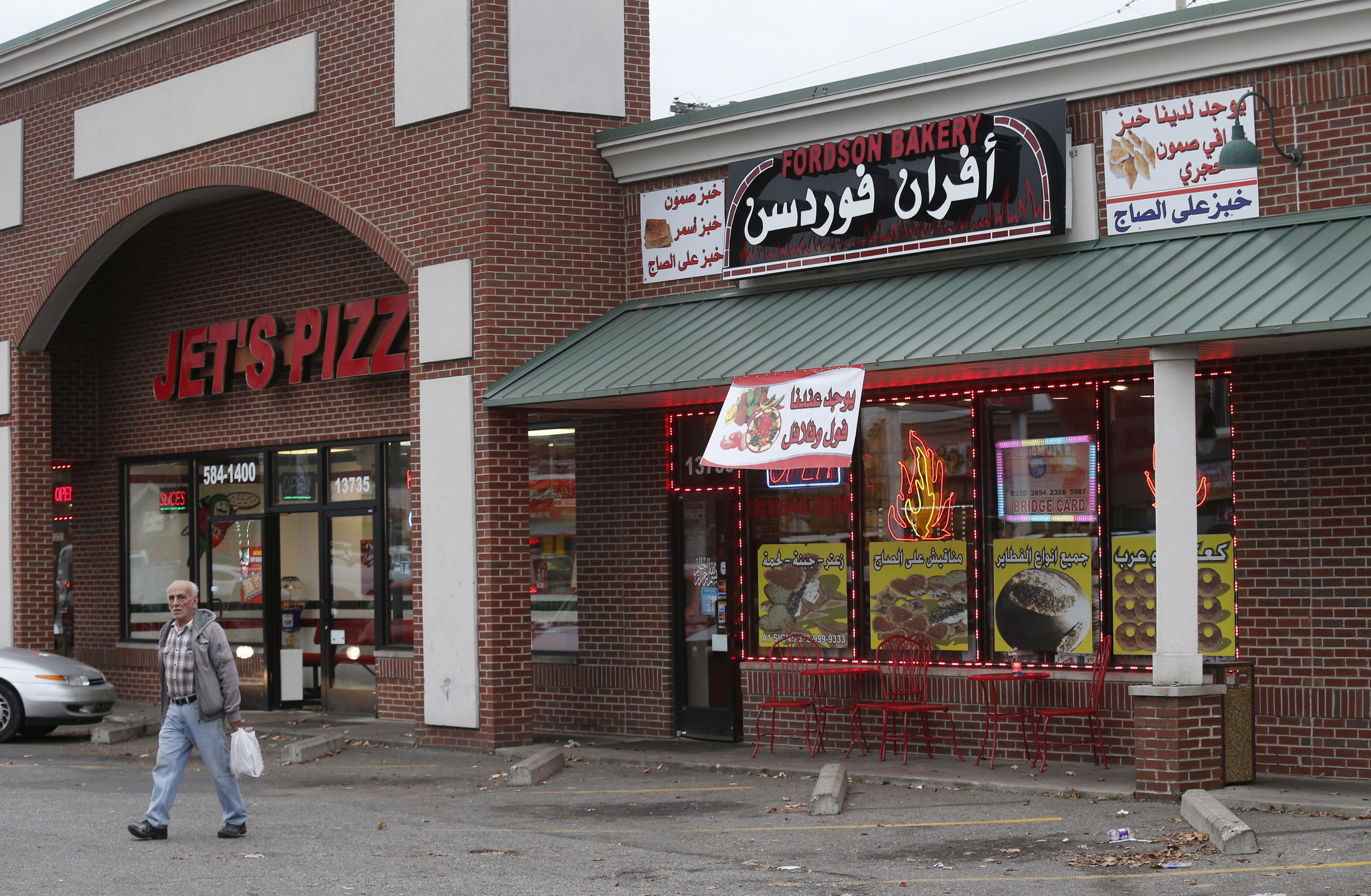 An Arabic restaurant is seen next to a pizza restaurant in Dearborn, Michigan November 17, 2015. To match Feature - FRANCE-SHOOTING/USA-MIGRANTS REUTERS/Rebecca Cook