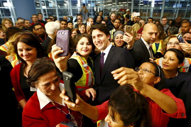 ...and pose for selfies with airport staff.