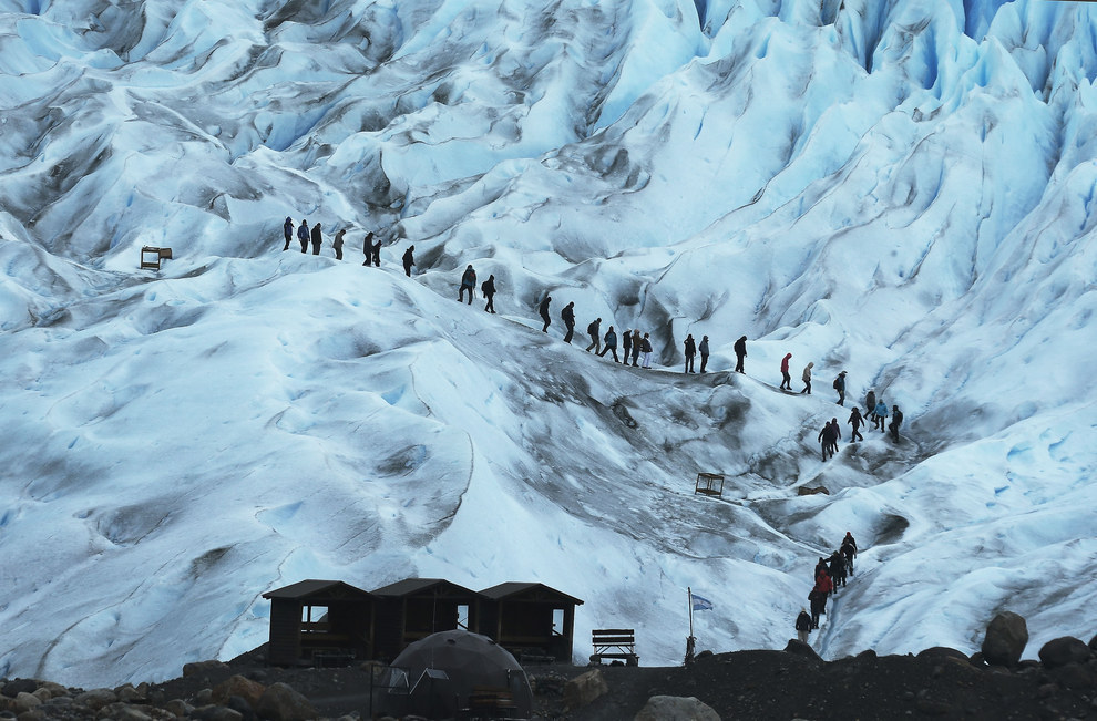 Santa Cruz, Argentina - A group of people go on a hike on the Perito Moreno glacier in Los Glaciares National Park. This is the third biggest ice camp in the world.