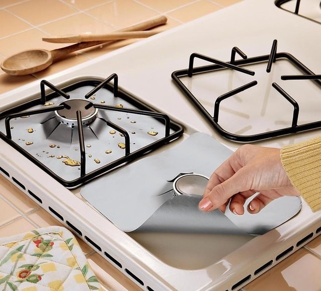...use gas hob protectors.These are reusable! But if you need a quick fix, you could always use foil.