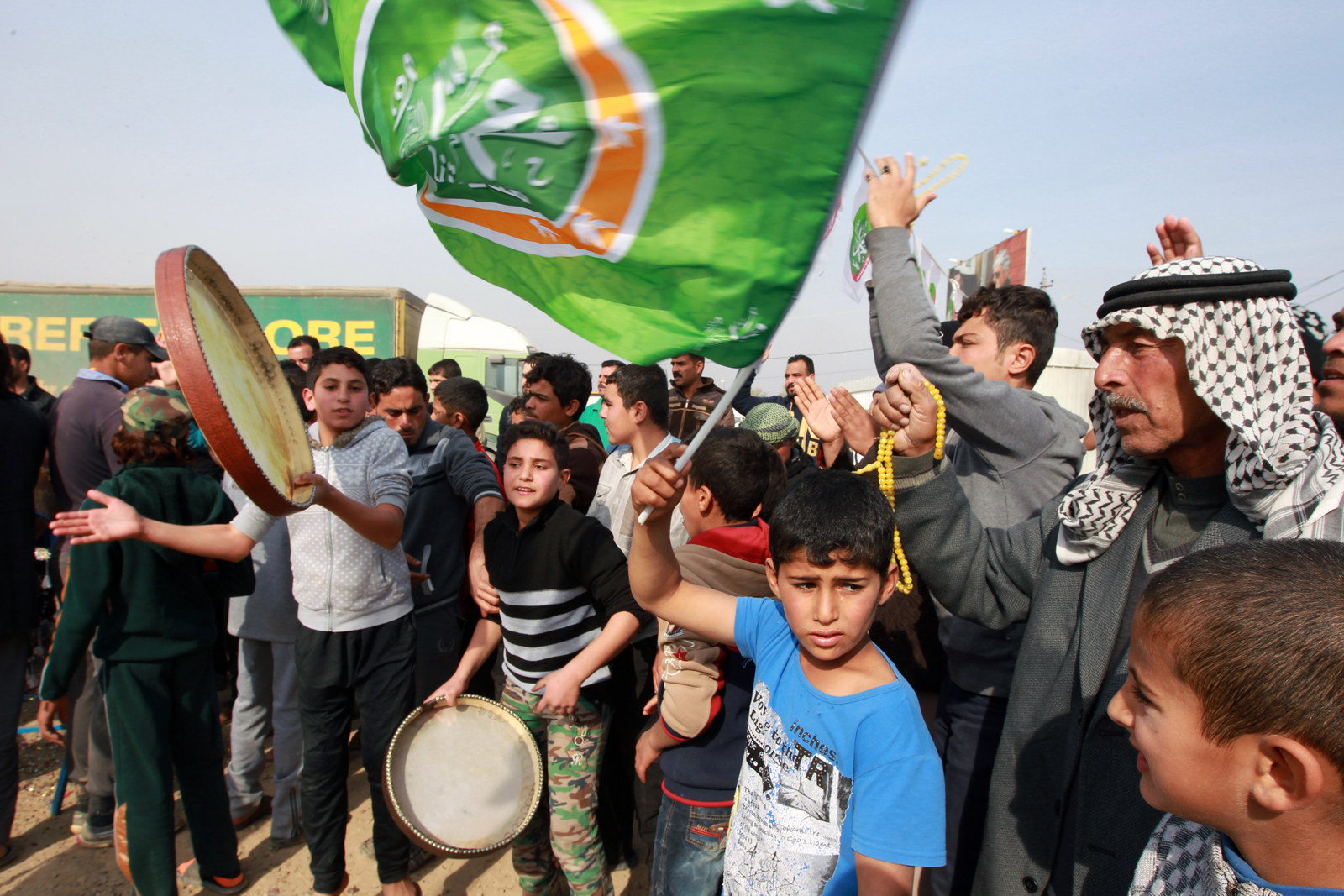 Displaced Ramadi residents celebrate at the Alkzenzanah camp in the capital Baghdad