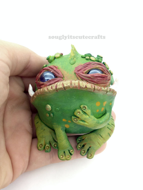 This artist sells her adorably expressive creatures and creations on Etsy. Look how thoughtful this little guy is! Either that or he's really judging you. Either way, I think he would be a great addition to anyone's shelf.