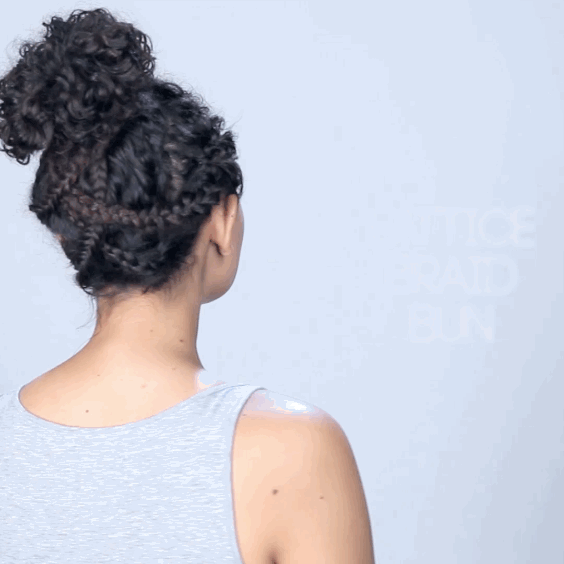 How to get the look:1. Create a small section of hair behind each ear, as well as two additional sections near the nape of your neck. 2. Secure the remainder of your hair up and out of the way for now. 3. Braid each of the four sections you created, securing with rubber bands. 4. Take the remainder of your hair and tie it into a high pony tail, then roll and tuck the pony into a bun, securing with bobby pins. 5. Create a lattice effect by pinning each of your four loose braids into the bun.