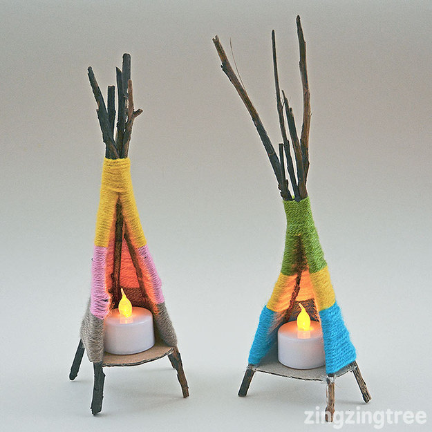 Gather some sticks and yarn to make teeny-tiny teepees.