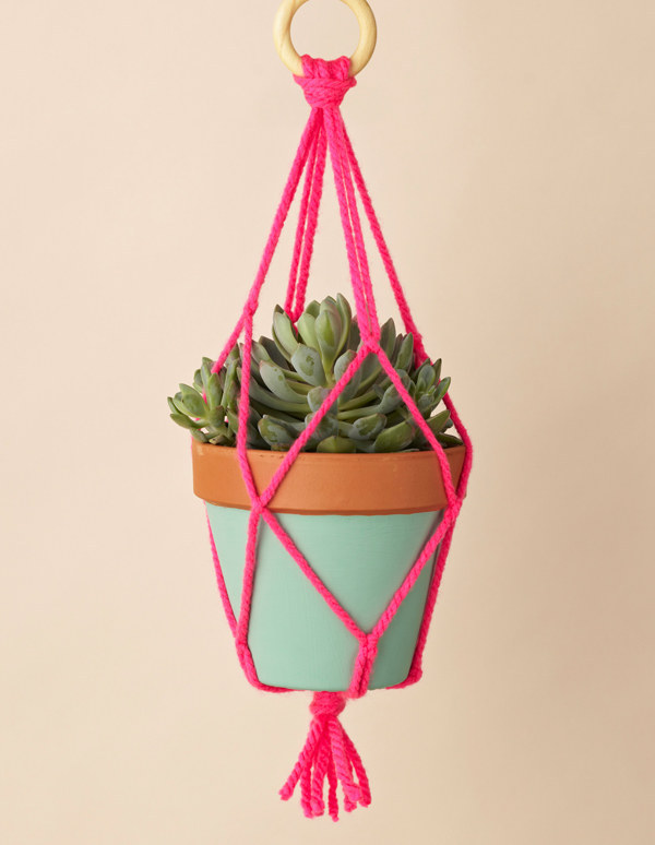 Speaking of macrame, display your plants with a neon macrame holder.