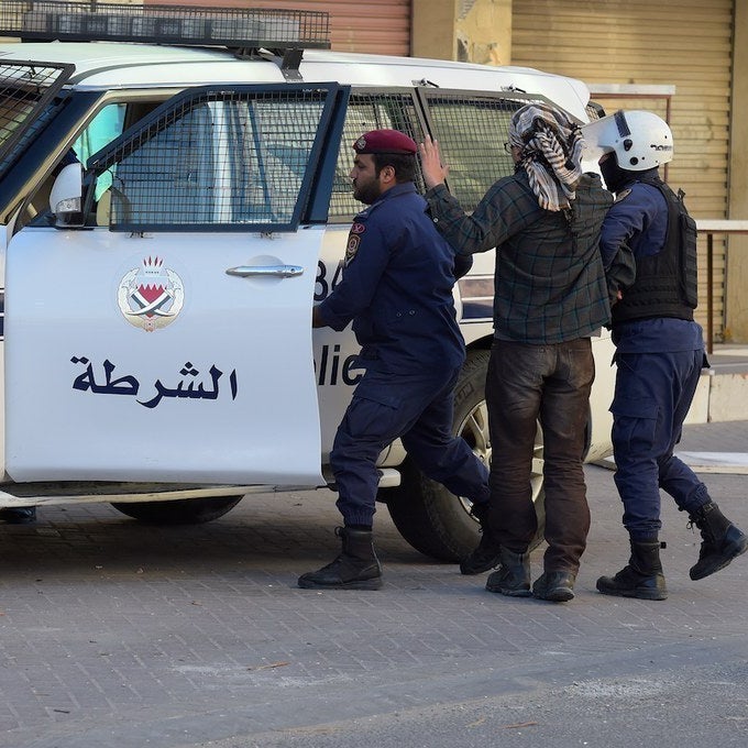 The man being arrested in this picture is reportedly one of the foreign journalists taken into custody.