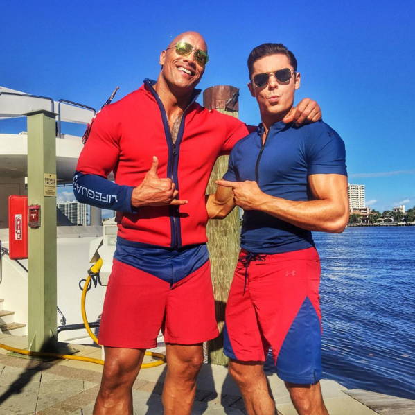 And by good I mean super hot fire because ladies and gents, The Rock and Zac Efron are here to save us.