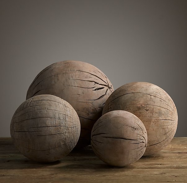 Chelsea: These look like dried coconuts you'd find on a tropical beach! It's like a West Elm version of Wilson.Joanna: They are wooden balls that cost $100.Chelsea: Each?!?Joanna: Yeah. Well, for the big ones.Chelsea: They are cracked! What do you do with those?Joanna: I guess you would just paint a face on it and talk to it.Chelsea: What if it rolled away? What if it got wet and got mildewy like a log? This stresses me out.